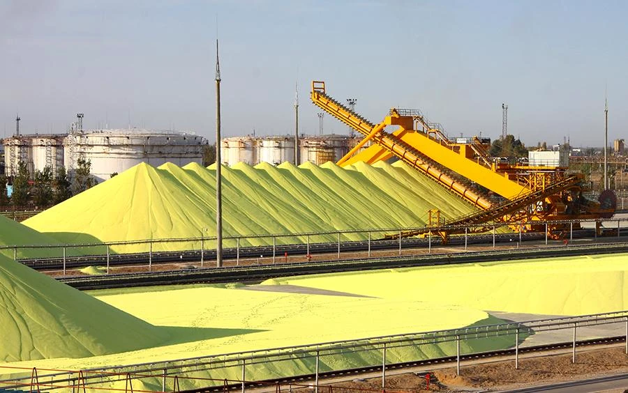 Large industrial sulfur stockpiles and conveying equipment